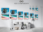 A size comparison chart displayed in an interior setting. The chart shows various sizes of tropical beach artwork featuring a palm tree pink sand and turquoise ocean. Find the perfect fit for your space.
