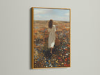 Gold frame artwork displayed in a well-lit room. The art captures a woman walking through a field of flowers. The golden frame adds a touch of luxury. It enhances the artwork's elegance. Find the perfect frame to showcase your art. Elevate your space with stunning framed artwork.