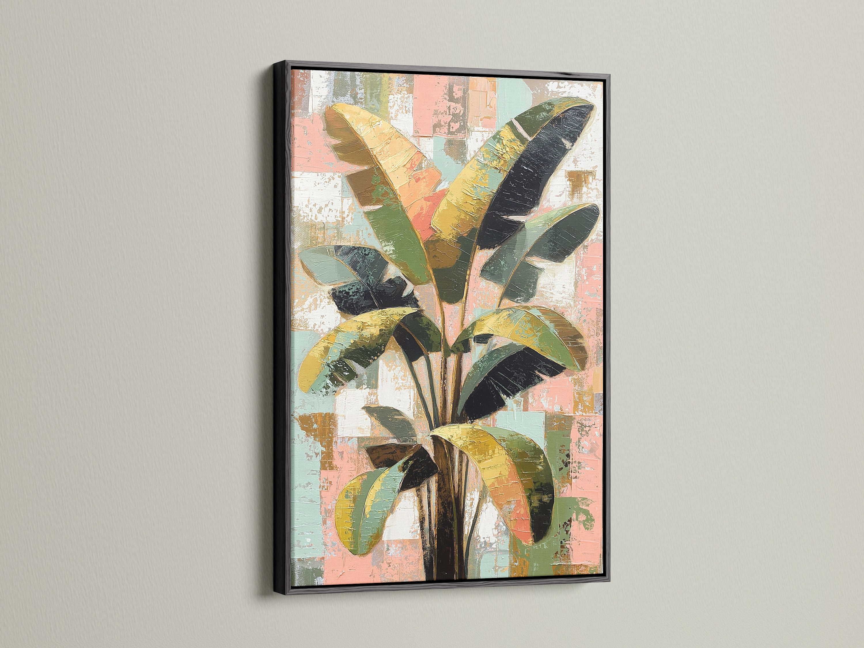 Tropical plant artwork featured in a black frame. This abstract palm leaf artwork creates a focal point. Green and pink tones complement any space. Perfect for adding plant wall art to your home.