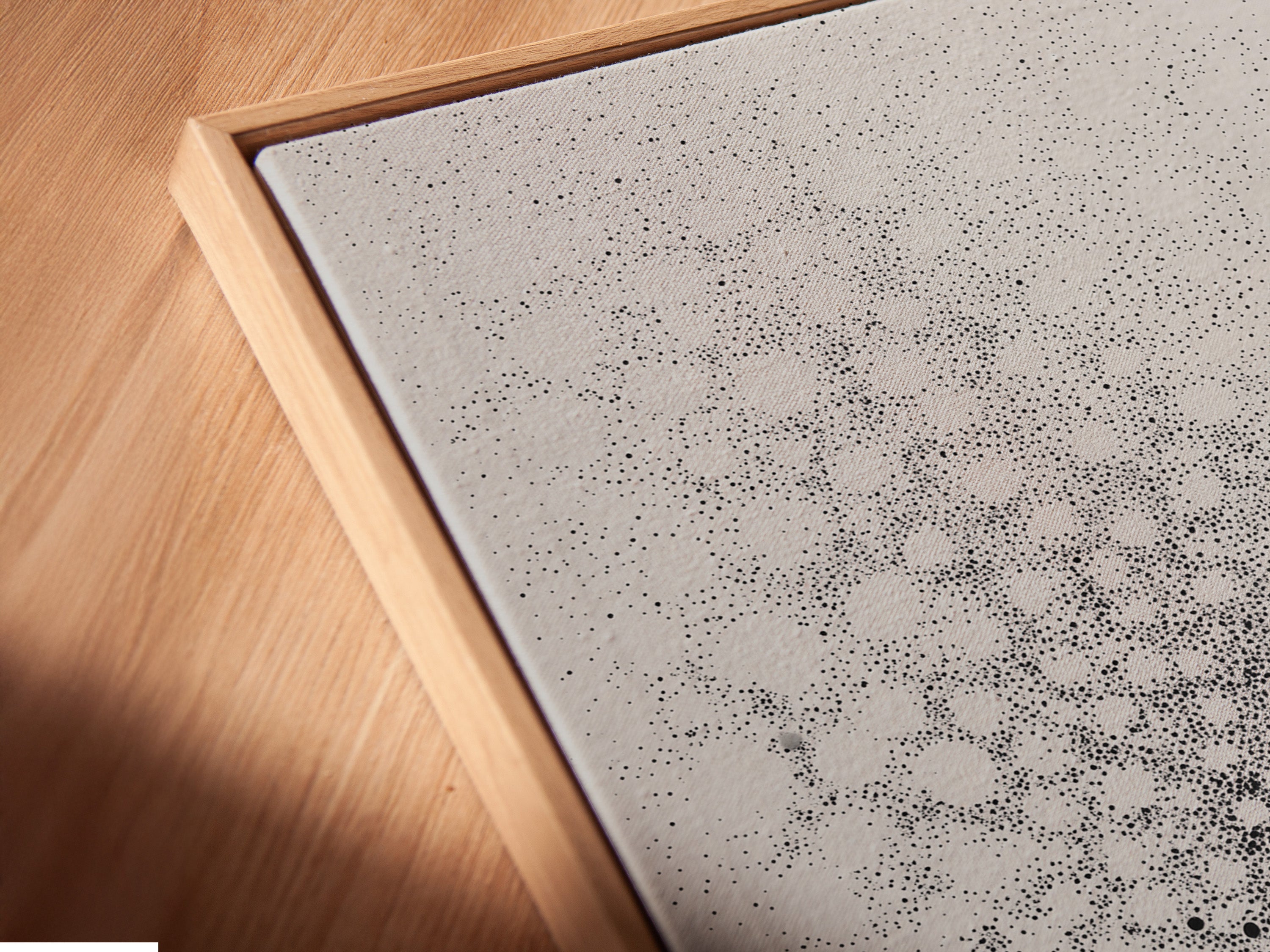 Here is a close-up angled view of a canvas print in a floating frame. The frame enhances the artwork. It creates a modern gallery look. This style adds depth and dimension. It elevates any piece of art