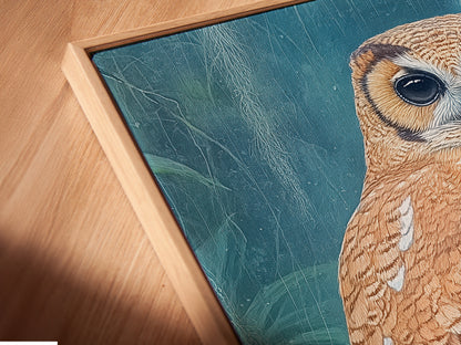 A close-up angled view reveals a canvas print in a floating frame. The artwork features a detailed owl. The floating frame enhances the artwork's visual appeal. It adds a modern touch to any room. Perfect for showcasing nature photography in your home.