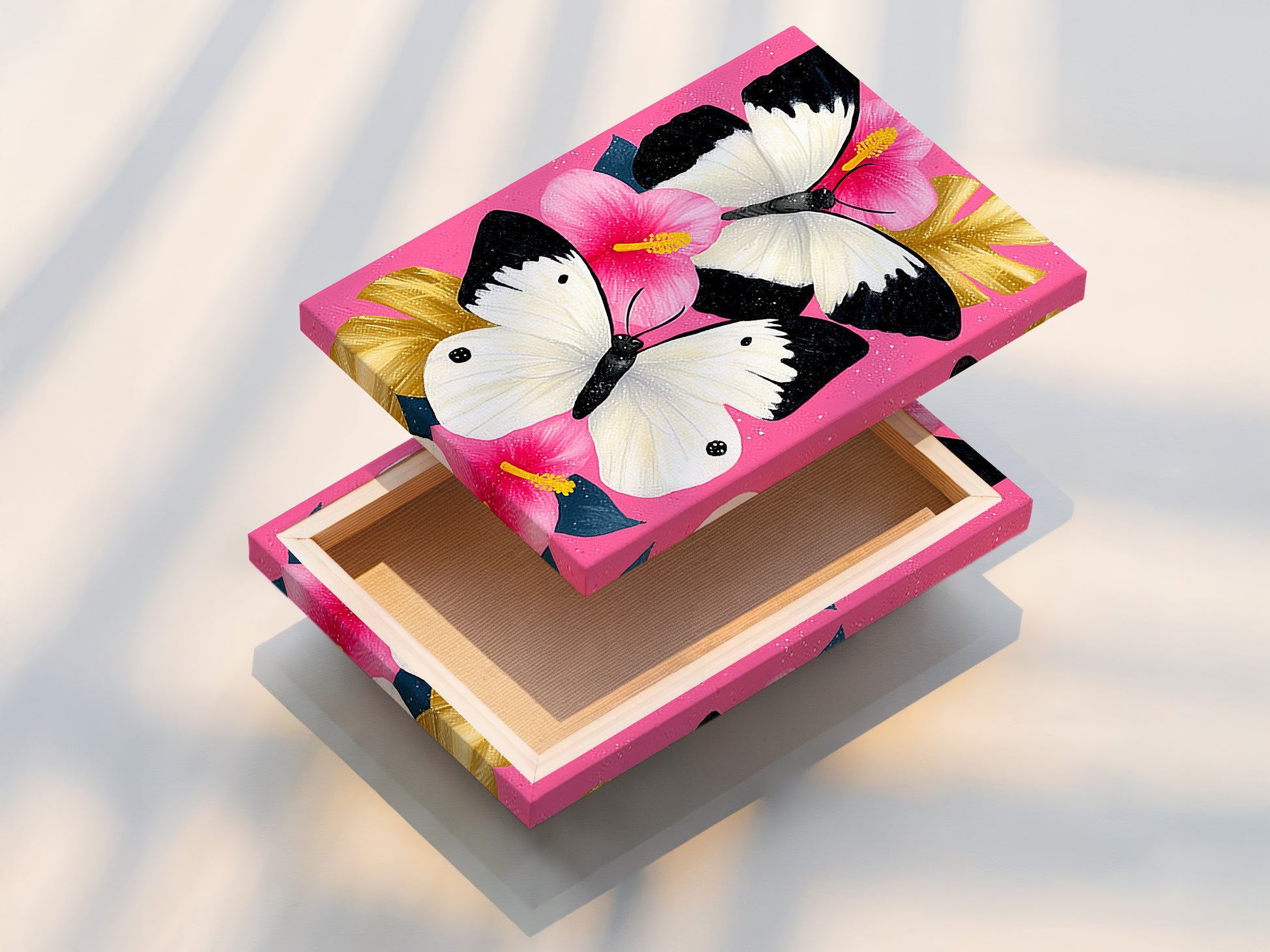 A stretched canvas print showcases a beautiful butterfly artwork. This pink hibiscus wall art features delicate white butterflies. This piece is perfect for adding a touch of nature and elegance to your home decor.