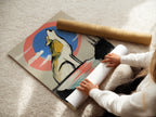 A woman is carefully rolling a fine art poster paper. The paper displays a wolf artwork. It features a howling wolf with a modern abstract coral blue sky. This high-quality print is perfect for framing. Ideal for collectors and art enthusiasts. Elevate your space with fine art.