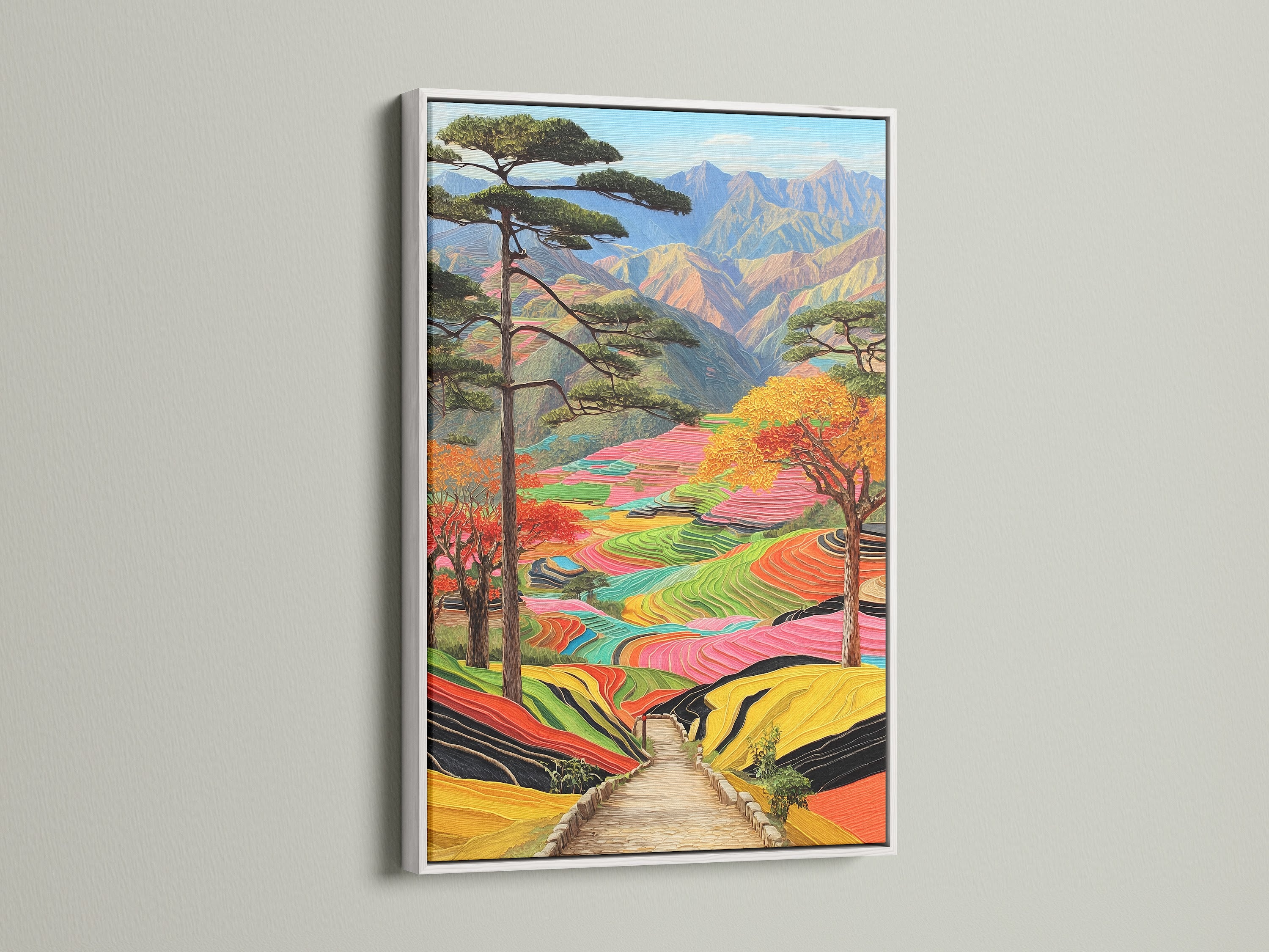 This is a colorful mountain landscape framed in white. The terraced rice fields artwork enhances any space. The white frame provides a clean modern look. This nature wall art is vibrant.