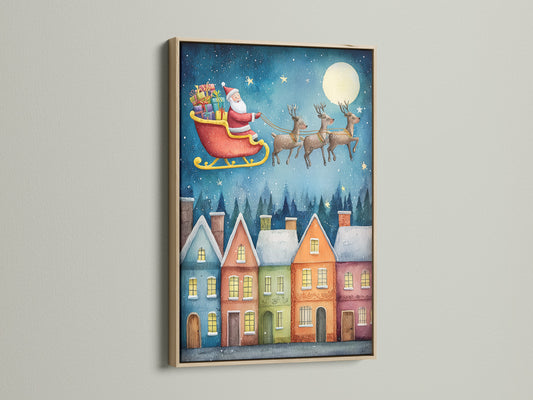 Santa's Sleigh canvas print in an oak frame. The holiday wall art enhances a farmhouse or country style. This winter town print adds a cozy feel. It's ideal for festive artwork and Christmas decor.