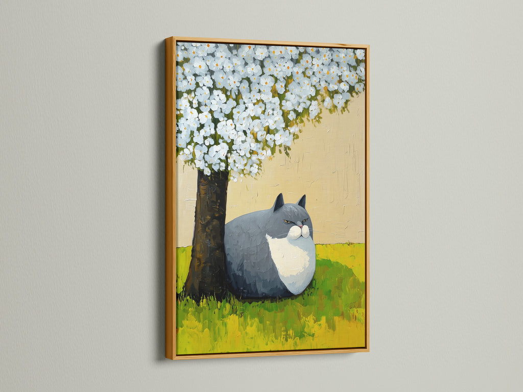A gold frame highlights a charming cat under tree artwork. This whimsical nursery art brings a touch of spring blossom beauty. It is a perfect cat lover gift and bedroom wall decor addition. The botanical cat art fits seamlessly into contemporary minimalist styles.