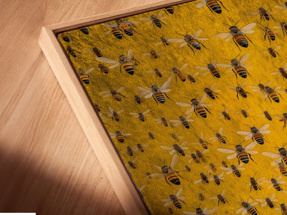 A close-up angled view of the canvas print in a floating frame. This modern framing style gives the artwork depth. The floating frame enhances the honey bee artwork. It creates a sophisticated look. Notice the fine details of the insect canvas in this presentation.
