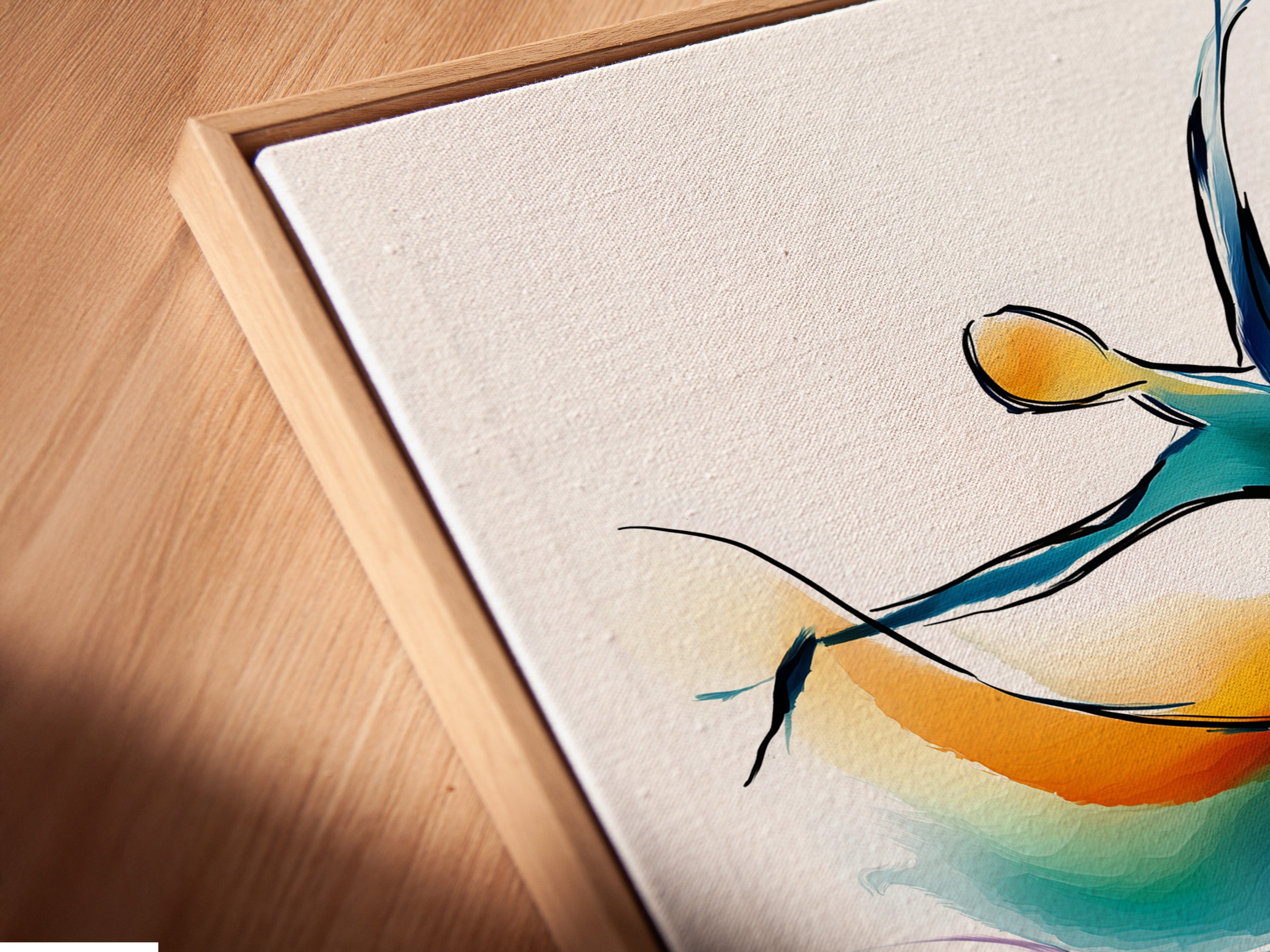 A close-up of a canvas print in a floating frame. The Abstract Dancer artwork shows a dancer in motion with teal orange and purple. This contemporary piece enhances any room. It is perfect for boutiques or studios.