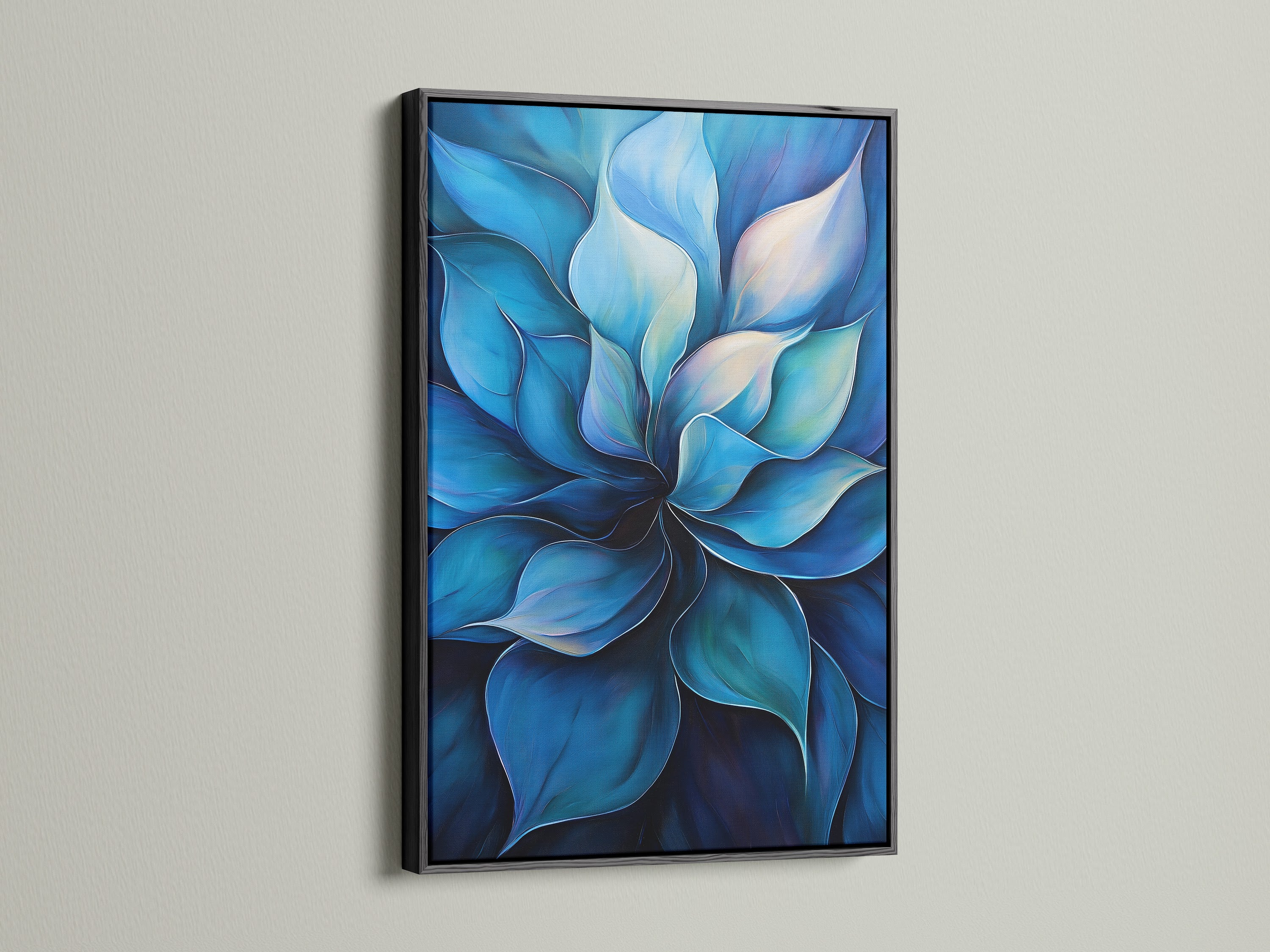 A blue flower artwork is set in a black frame. The contrast of the black frame makes the blue hues pop. This modern floral painting is ideal for a sophisticated look. It is suitable for living rooms offices and reception areas. The black frame adds a touch of elegance to this botanical artwork.