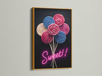 Lollipop Candy Artwork with a Gold Frame. This confectionery print is a sweet treat for your walls. The fun wall art adds a pop of color to any space. It is ideal for modern or eclectic interiors. Consider it for a unique sweet tooth gift.