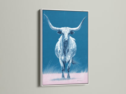 Here is a longhorn bull artwork in a white frame. This piece offers western home decor with a modern twist. The bull canvas print is ideal for farmhouse decor. It enhances any living room or office space.