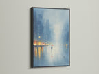 Add sophistication with our cityscape canvas. It is displayed in a black frame. This urban artwork captures a rainy day scene with cool blue tones. Ideal for modern office wall decor or a stylish home gallery. See the impact of city scene art. A perfect blend of contemporary style