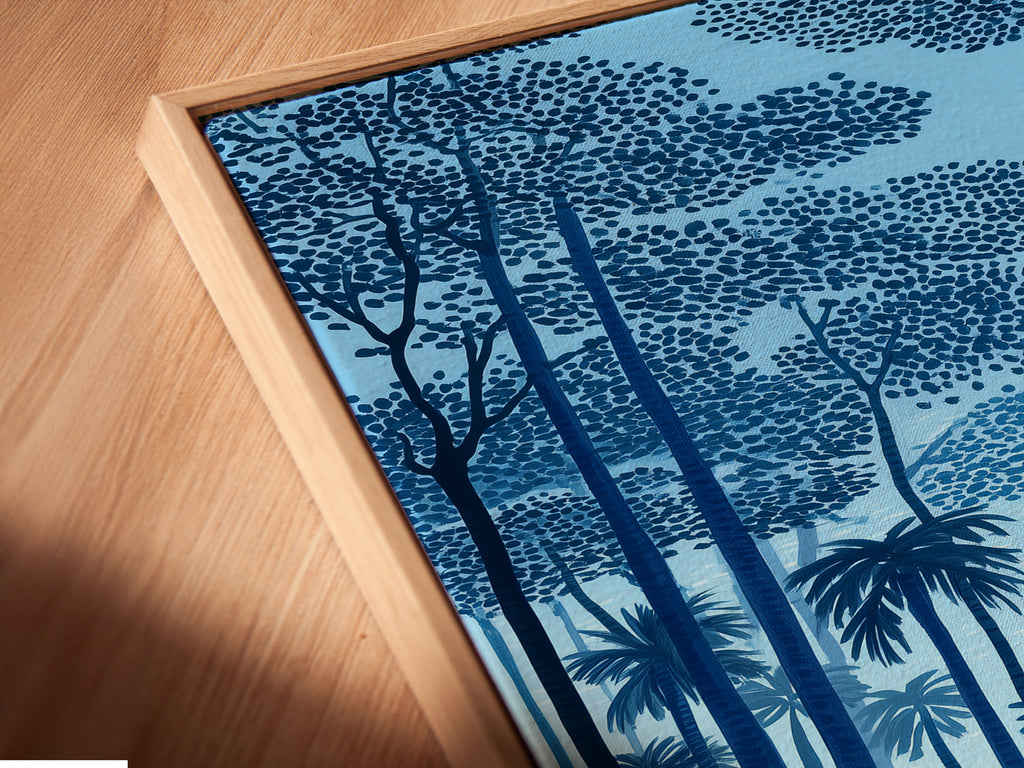 A close-up angled view of a canvas print in a floating frame. The tropical beach artwork brings a coastal seascape to your home. Notice the fine details of the indigo blue sunset and palm tree art. This piece is perfect for adding a touch of island art to any space.