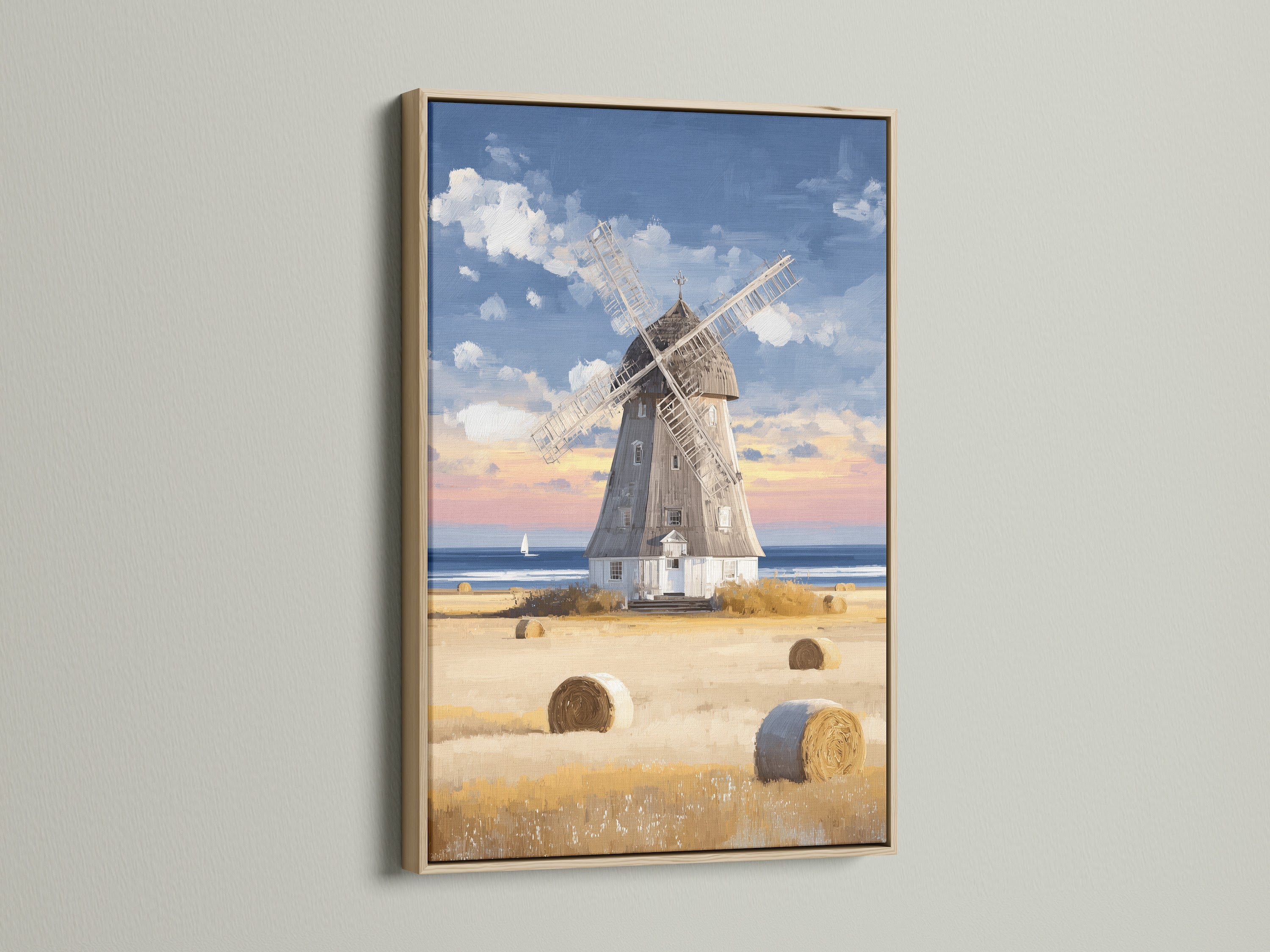 A captivating windmill artwork in a light oak frame adds warmth to any space. Showcasing a coastal countryside scene with hay bales it brings rustic charm to your home. This framed art is perfect for lovers of vintage farmhouse decor and tranquil landscapes. The neutral tones blend seamlessly with various interior styles.