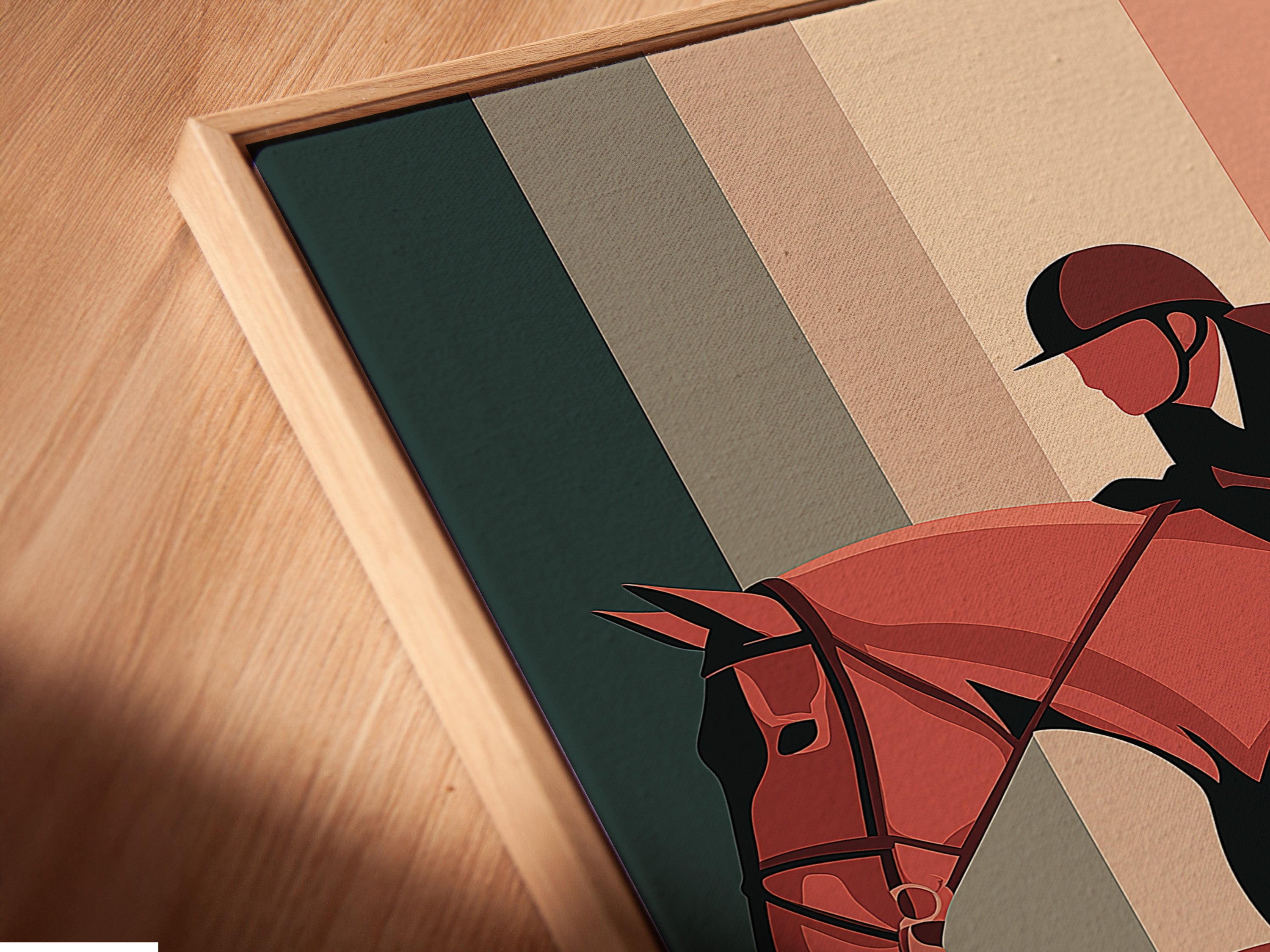 A close-up shows a canvas print in a floating frame. The floating frame gives the art a modern gallery look. The artwork features a horse and rider mid-jump. The frame enhances the artwork beautifully. This adds depth and dimension.