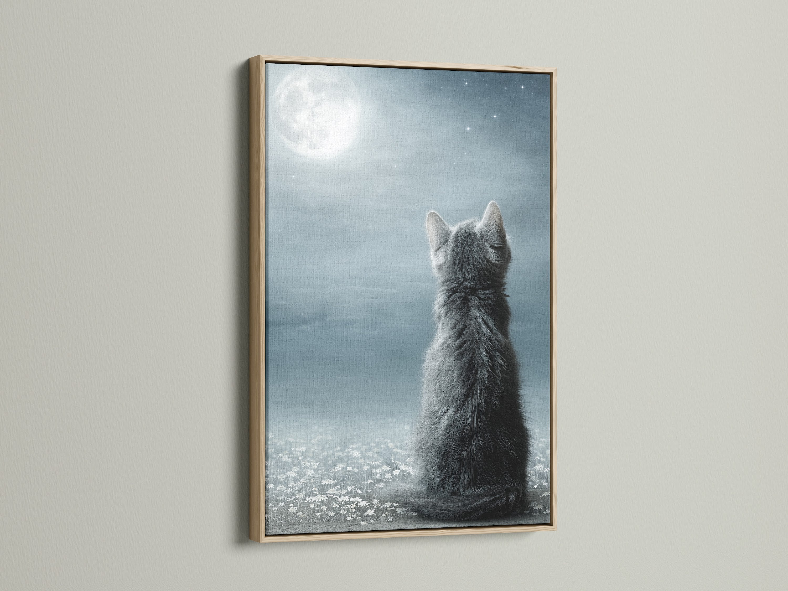 A close-up of the Cat Moon Canvas Print in an oak frame. The warm wood complements the cool gray and blue tones of the artwork. This celestial kitten poster is ideal for nursery wall art. Enhance your space with this charming and modern piece.