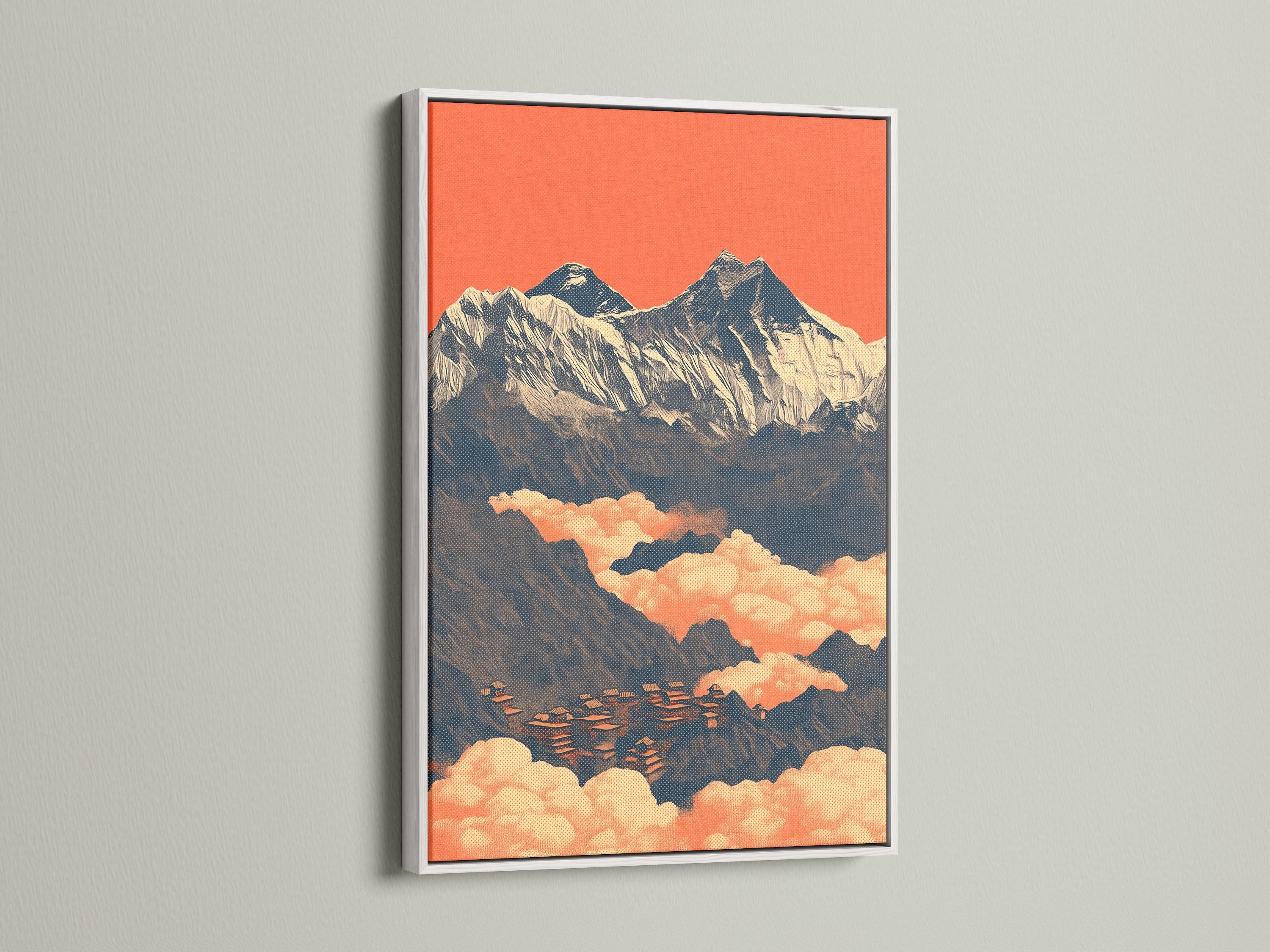Himalayan wall art displayed in a white frame. This mountain canvas features a vintage travel poster of a mountain peak. The peach and teal color palette enhances any room. Elevate your home decor.