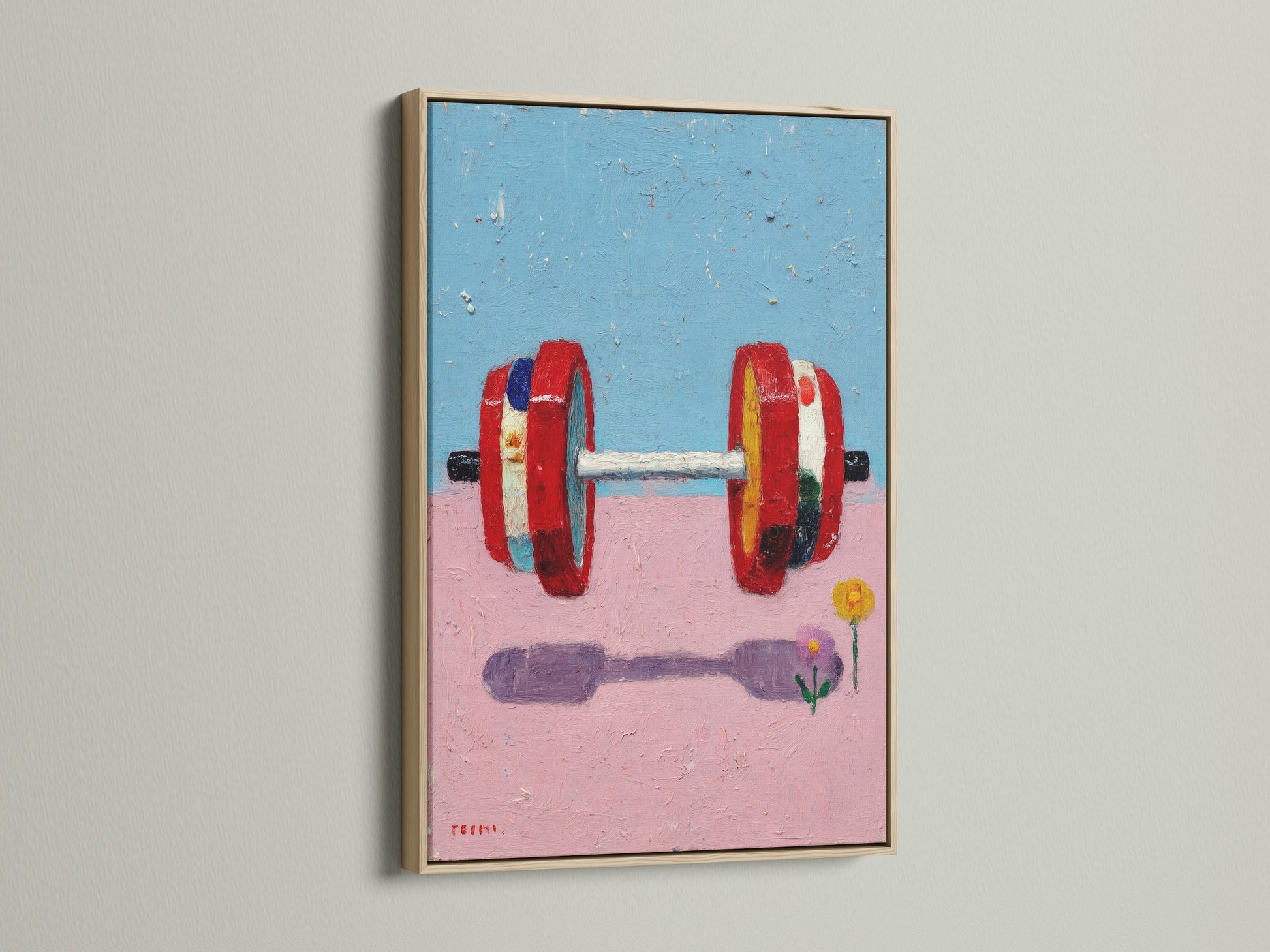 A close up of a fitness art print with a dumbbell motif. The artwork is framed in a light oak frame. This gym wall decor is perfect for adding a touch of contemporary style to your workout space. The abstract design features pink and blue hues. It is ideal for home gym or fitness studio.