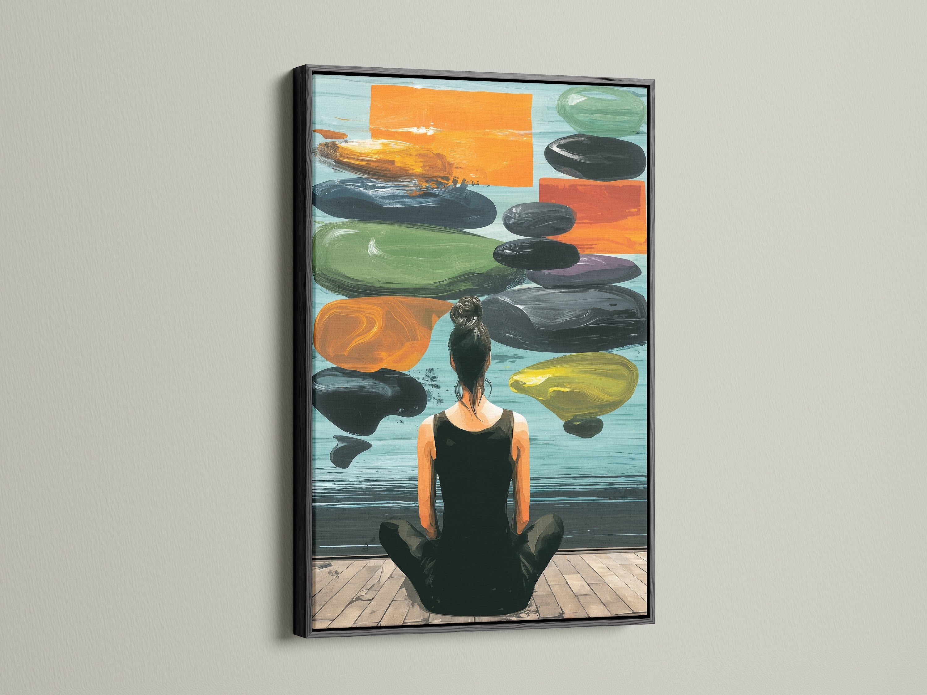 Zen Wall Art in a black frame is displayed on a white wall. This artwork features a woman meditating. The artwork creates a peaceful atmosphere. This art is perfect for creating a serene space.