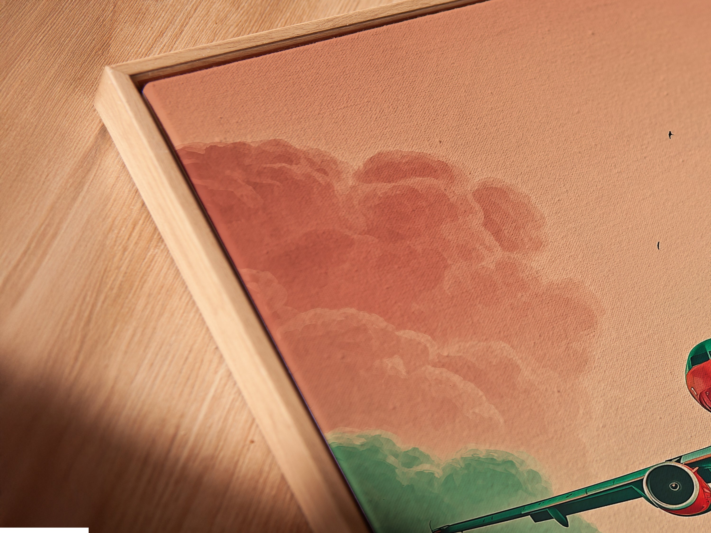 Close-up angled view of a canvas print in a floating frame. The aviation artwork features an airplane in a teal and coral sky. This modern art print adds sophistication. Perfect for living rooms bedrooms and offices. This aviation decor makes a great travel gift. Order your art today