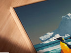 A close-up of a canvas print in a floating frame. The penguin artwork captures the beauty of arctic wildlife. This piece is perfect for adding a touch of marine life to a modern interior. This contemporary artwork is great for any room