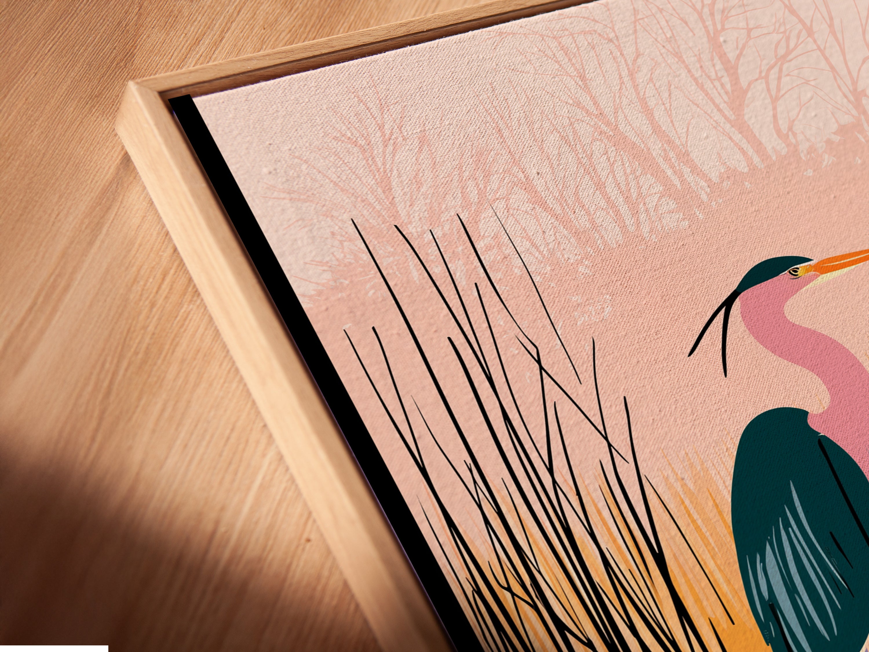 A close-up of a canvas print in a floating frame. See the heron artwork seemingly suspended within the frame. This modern framing style adds depth to the coastal wall art. It is perfect for minimalist interiors.