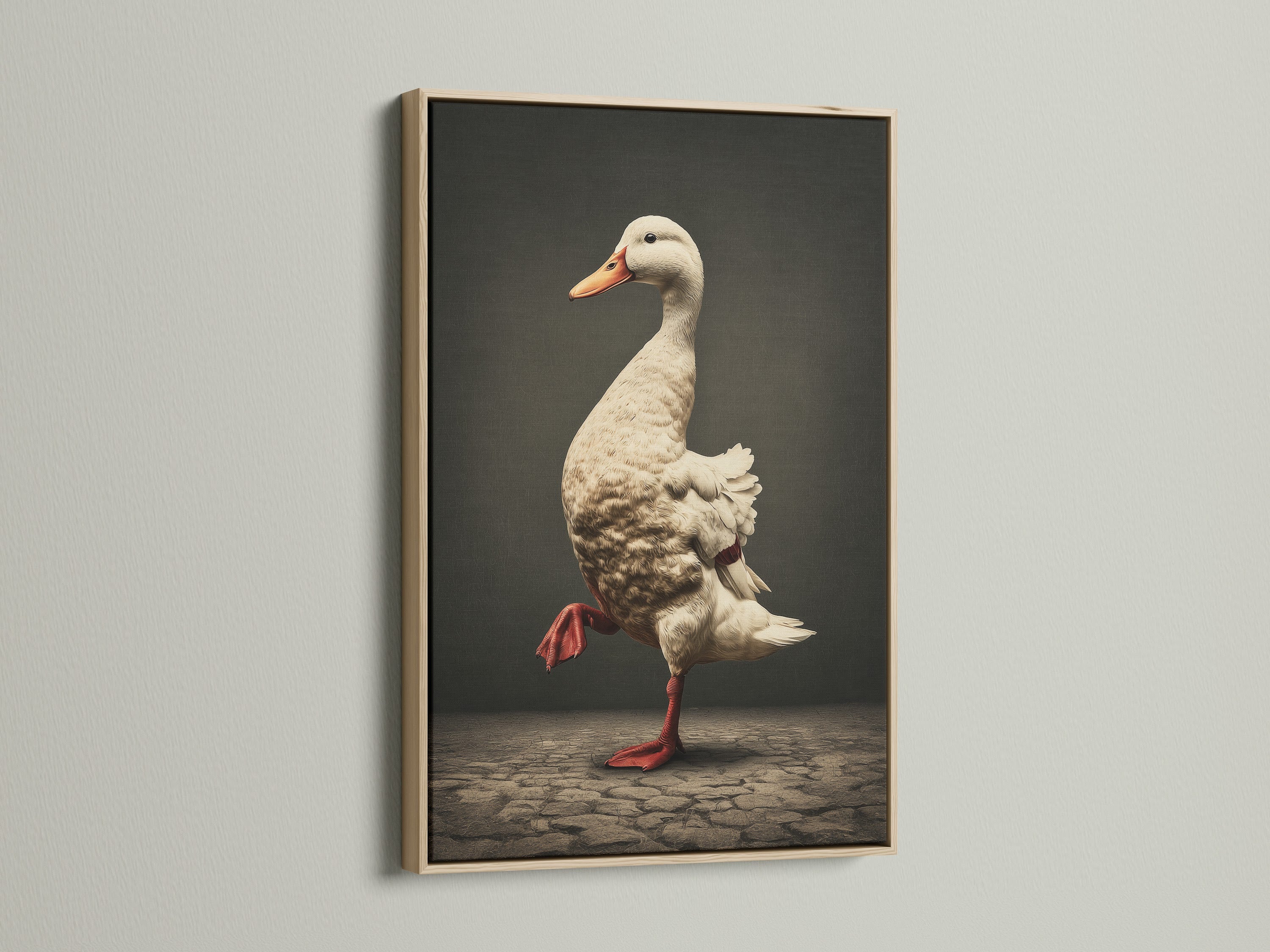 Vintage Duck Canvas Artwork in an oak frame. The artwork features a duck wearing red boots. It is whimsical farmhouse decor. The oak frame enhances the country style. This art is ideal for kitchen wall art.