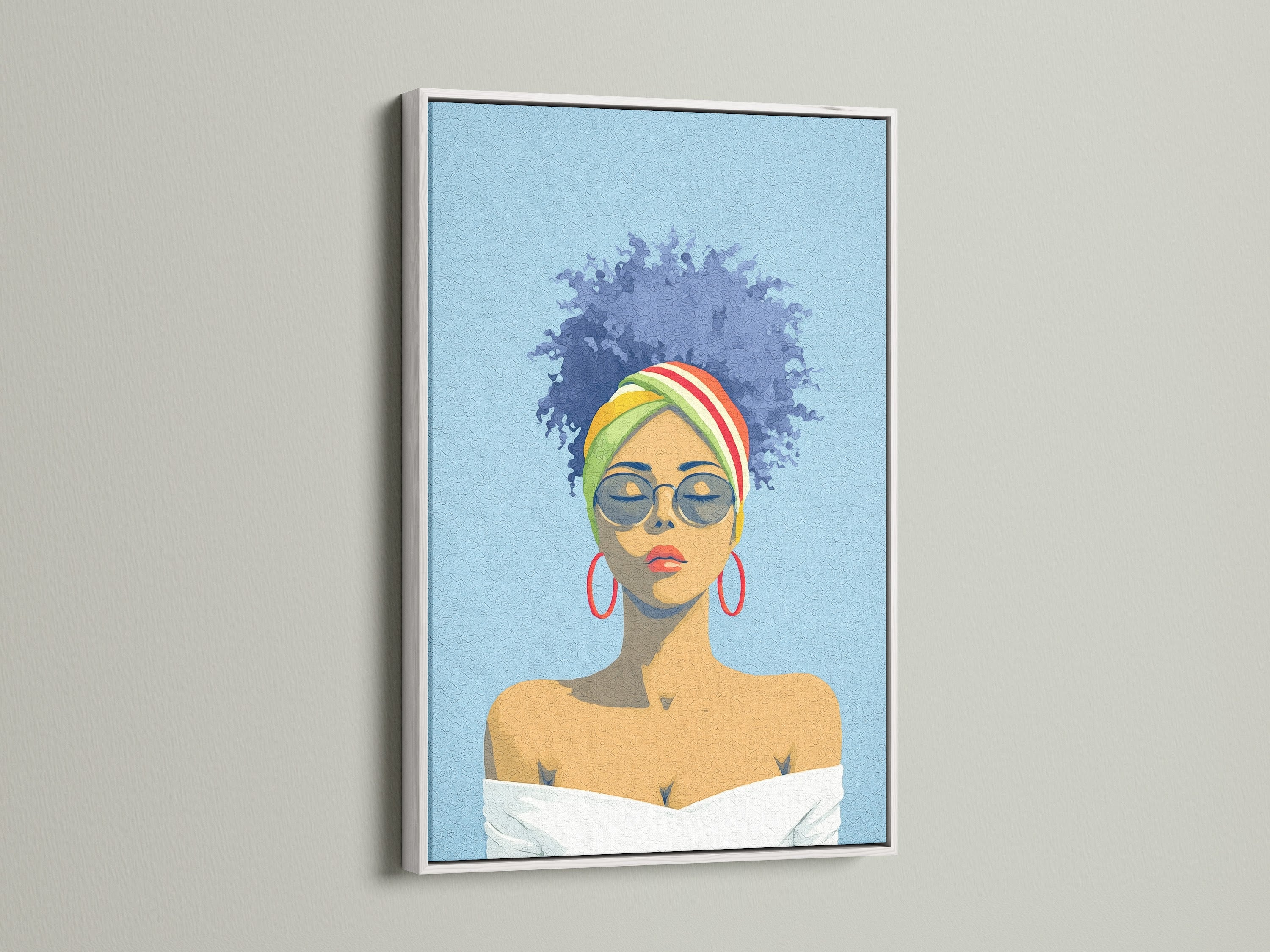 Black Girl Magic artwork with a white frame hanging on a white wall. The canvas print features a woman with a colorful headwrap and red hoop earrings. Ideal for adding a pop of color to bedroom wall decor.