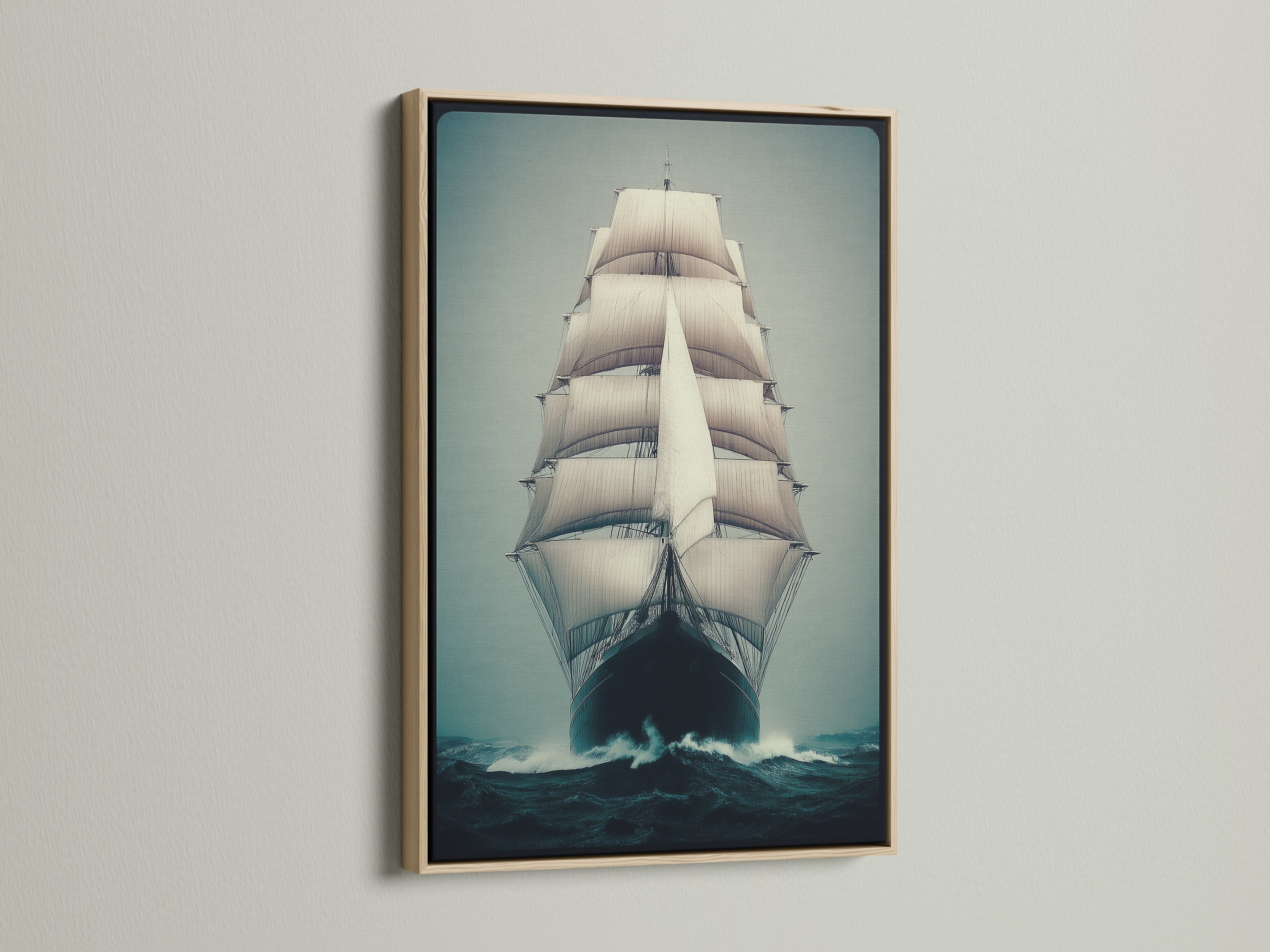 A stunning Sailing Ship Canvas Print with an oak frame. The vintage nautical wall art captures the essence of the ocean. This ocean vessel print enhances coastal wall decor beautifully.