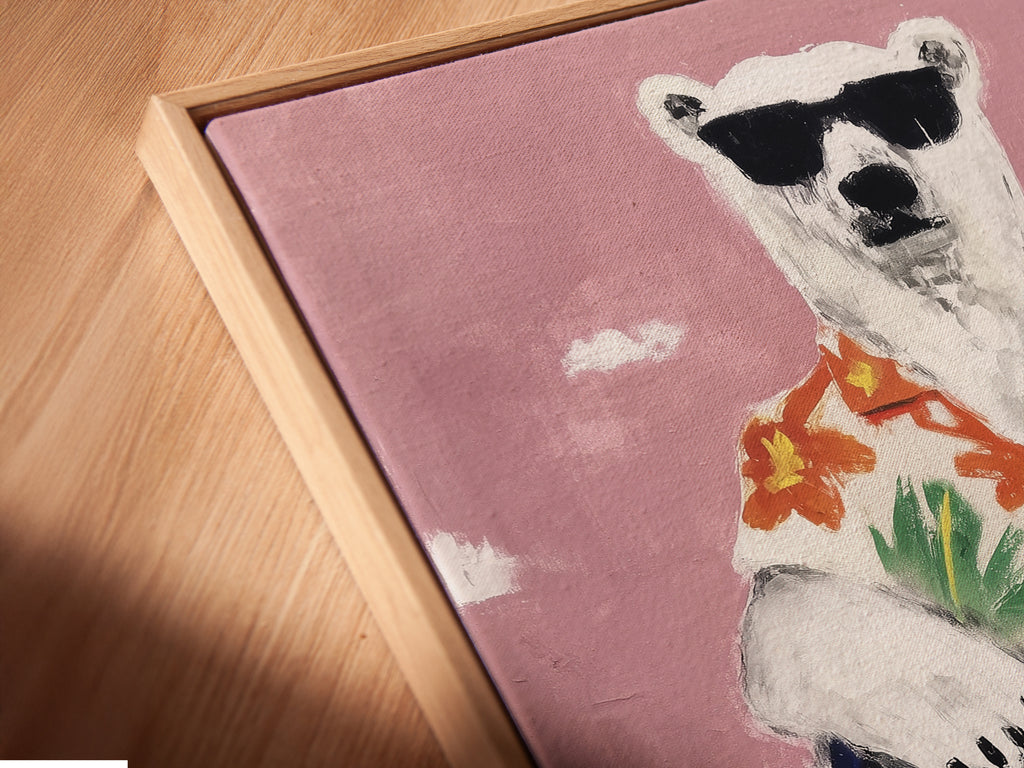Close up of a cool polar bear canvas in a floating frame. This funny animal print offers a modern look. Perfect for adding tropical vibes to your walls. This quirky art print is ideal for playful decor.