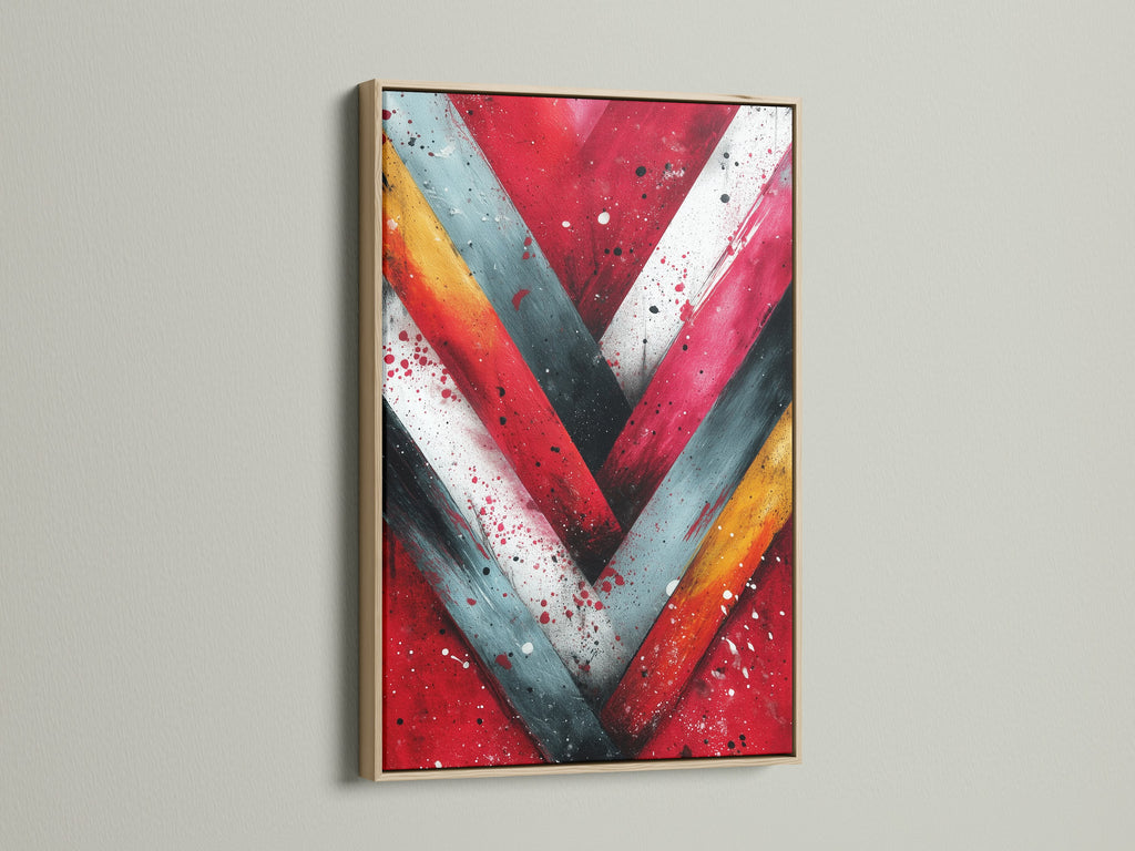 Enhance your walls with our Chevron Print Geometric Canvas in an oak frame. The red and teal art provides a modern brushstroke. Ideal for homeowners renters and interior stylists. Discover contemporary artwork for any space.