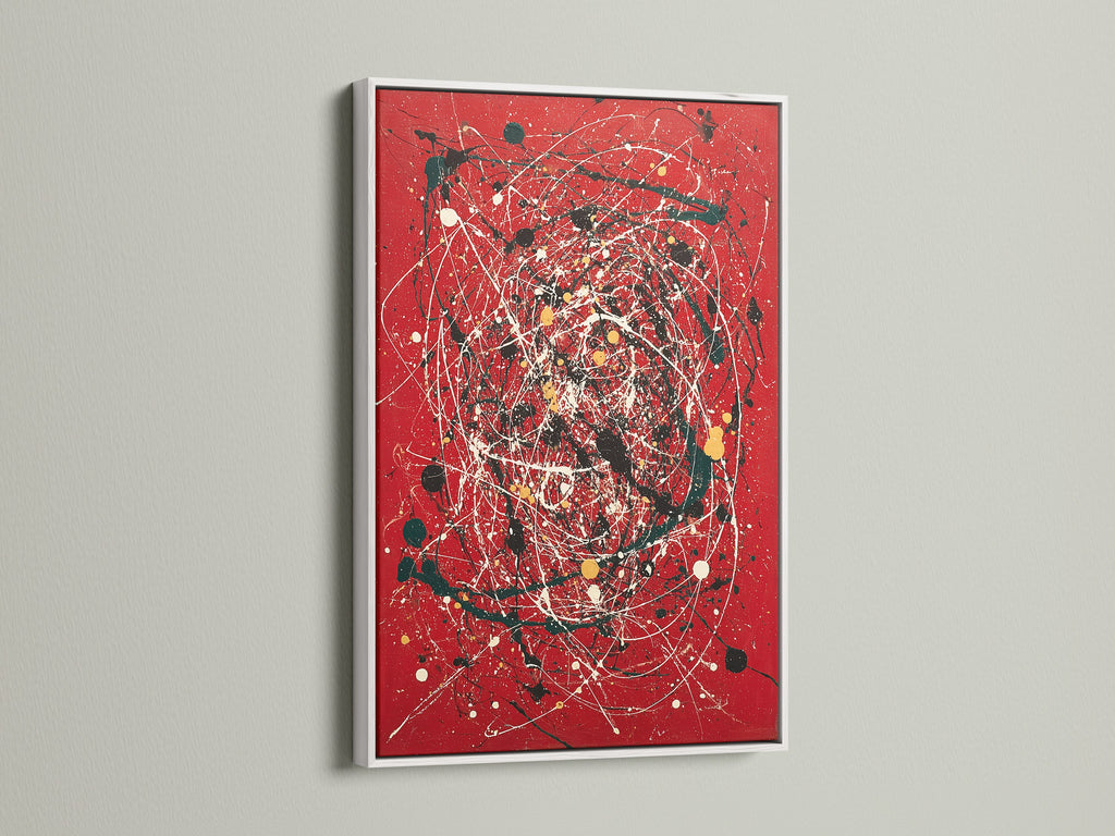 Modern abstract wall art with a red canvas print. The artwork is presented in a clean white frame. Splatter and paint drip effects create a contemporary feel. This piece is ideal for modern home decor. It enhances living rooms offices and creative spaces. A bold addition to any art collection.