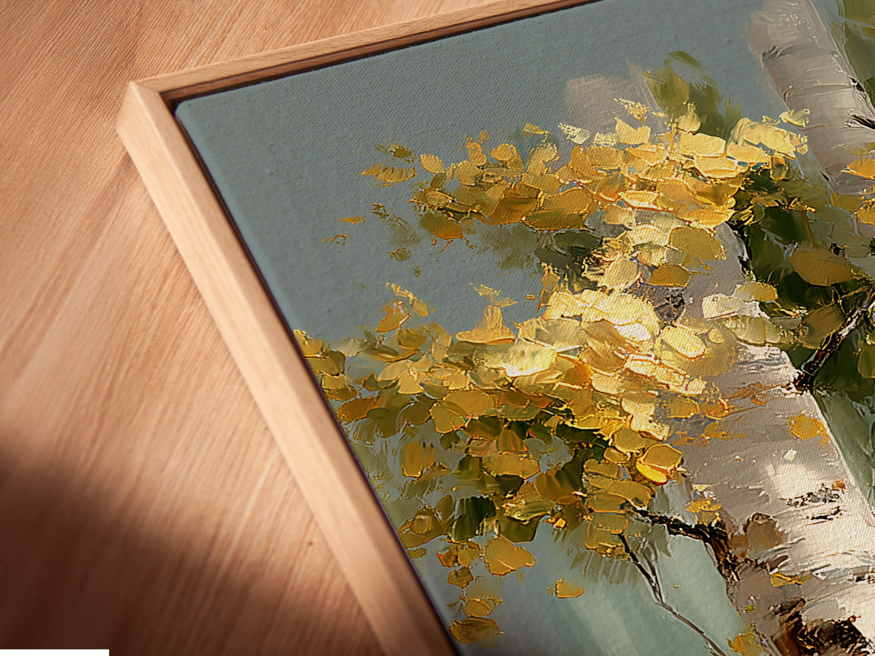 A close-up of a canvas print in a floating frame. The artwork is the birch tree canvas print. The floating frame enhances its rustic style. It is perfect for adding a touch of nature to your home.