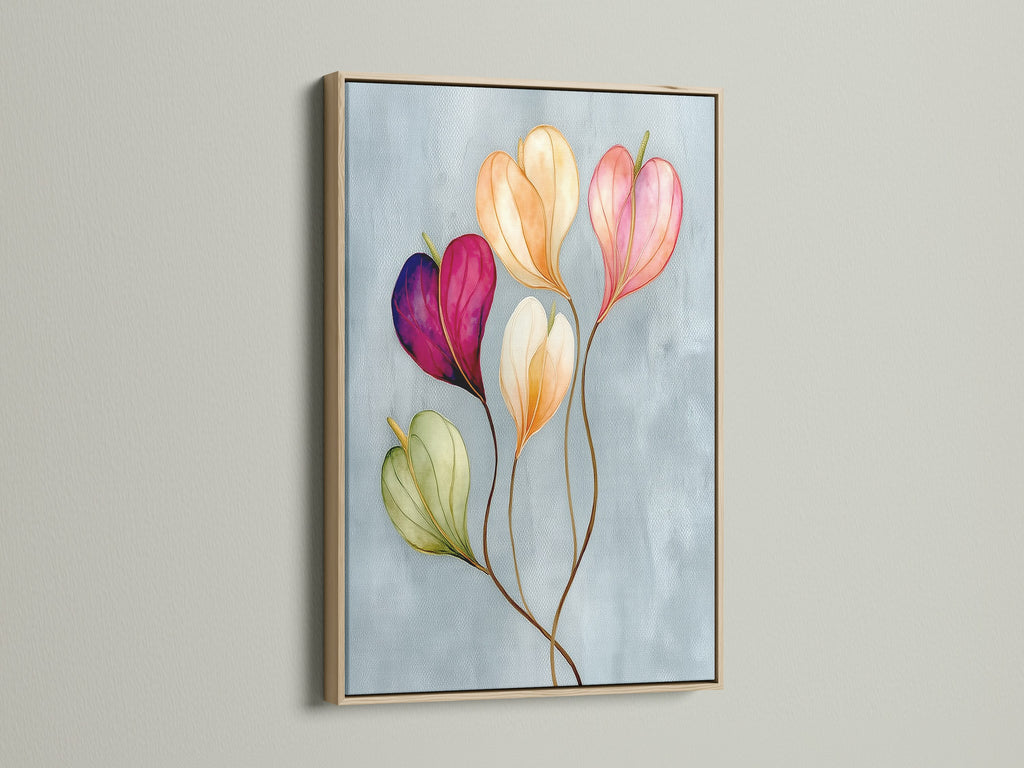Floral watercolor canvas print in an oak frame is displayed. It is a pastel flower art that enhances spaces with modern botanical artwork. Perfect blush pink decor for Living Room Wall Art Bedroom Wall Decor or even a stylish Office Wall Art.
