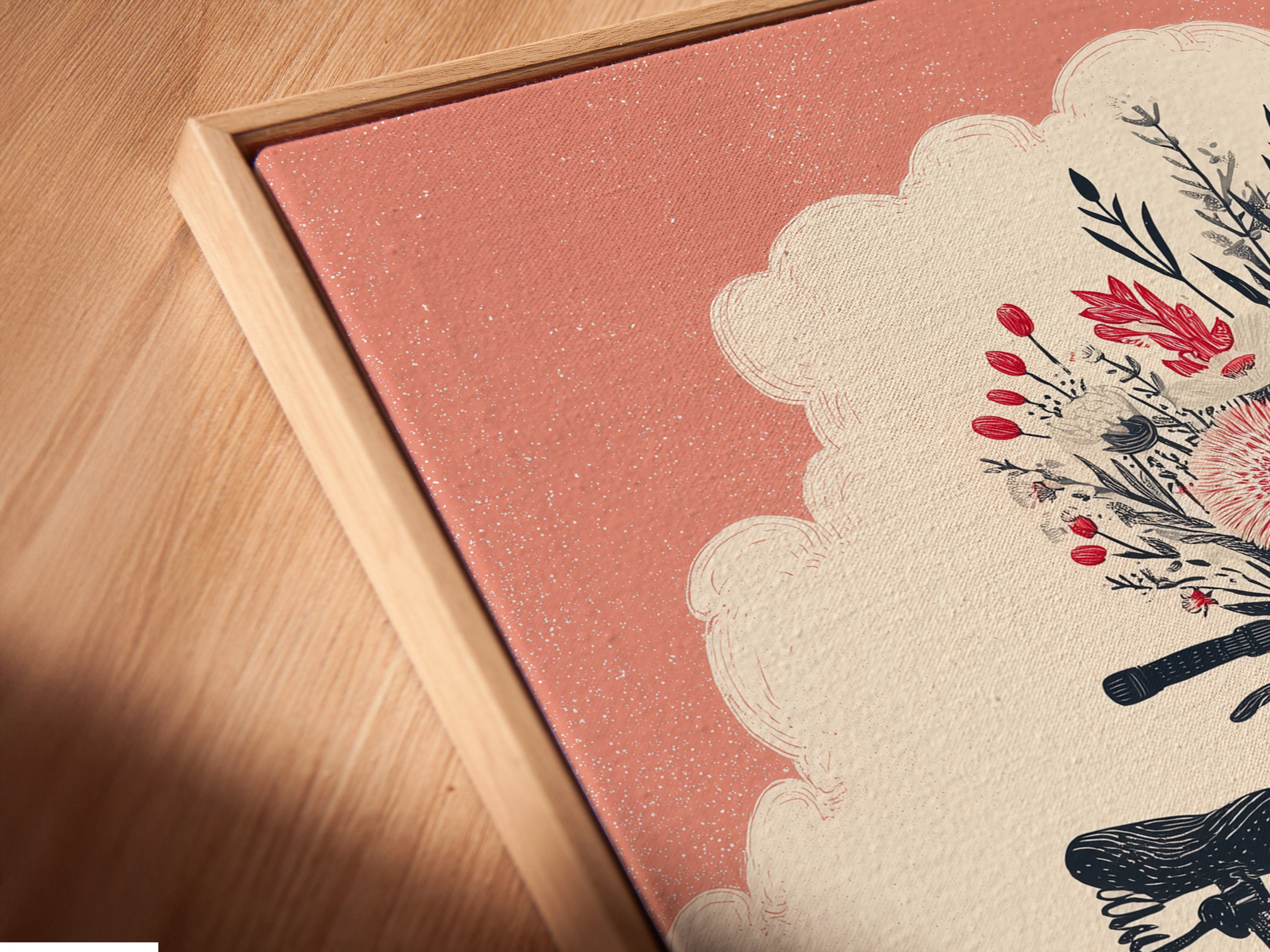 A close up of a canvas print in a floating frame. The vintage bicycle artwork features a coral pink floral bike. It is a whimsical botanical poster perfect for bedroom decor. The floating frame enhances the art. It brings a modern touch to any room.