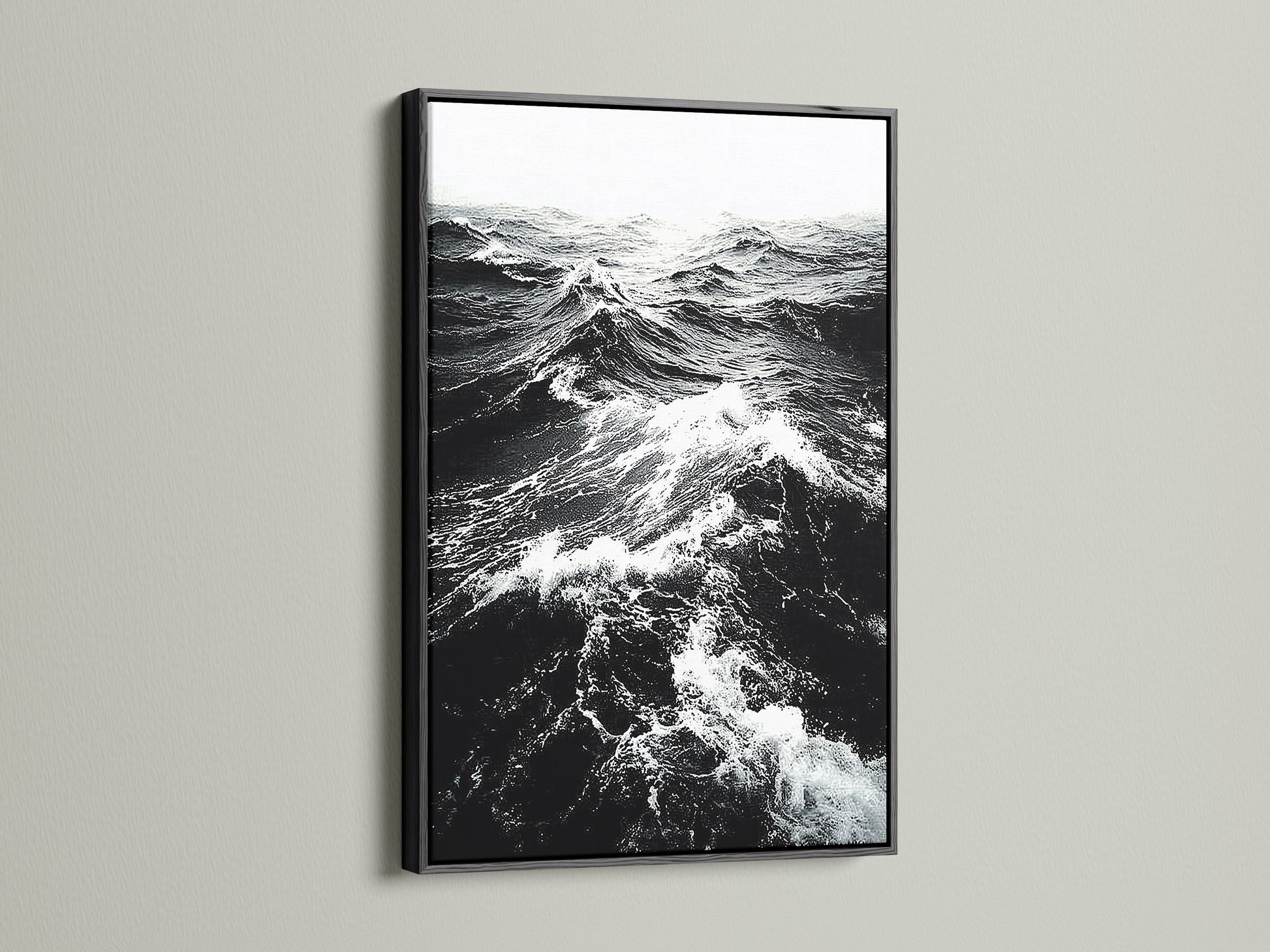 A black frame displays black and white ocean wave artwork. This classic frame creates a dramatic effect. Ideal for monochrome art and ocean photography. Enhance your living room wall art today explore our options.