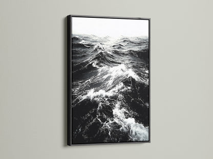 A black frame displays black and white ocean wave artwork. This classic frame creates a dramatic effect. Ideal for monochrome art and ocean photography. Enhance your living room wall art today explore our options.