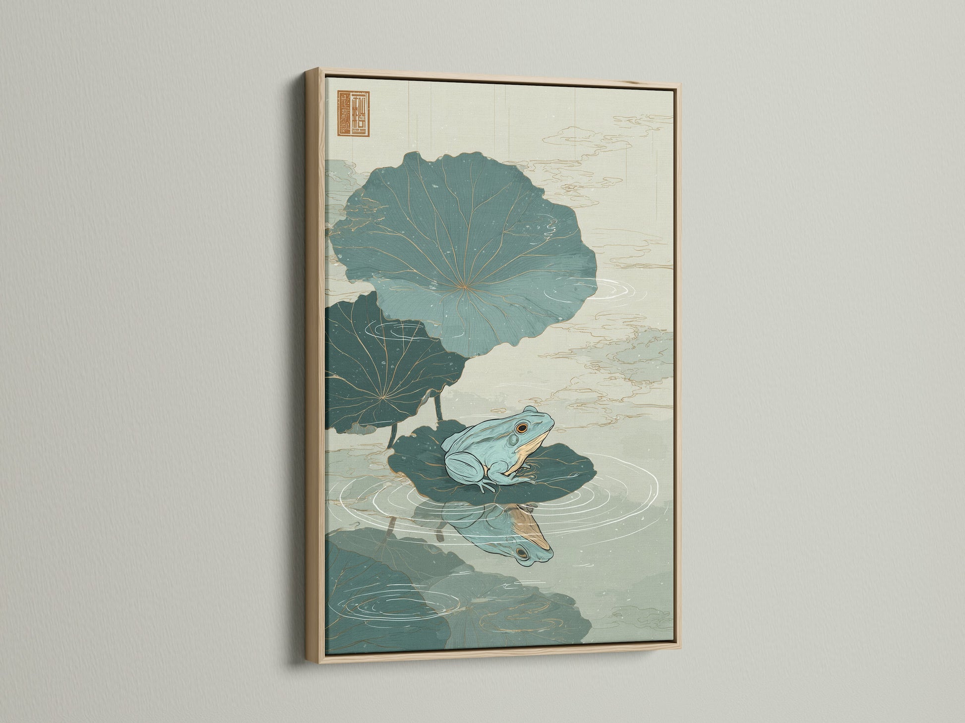 Artwork featuring a green frog sitting on a lily pad in an oak frame. The oak frame enhances the artwork's natural theme. This framed artwork is a stylish addition to your home decor. Discover the beauty of framed art. Elevate your space with this stunning piece.