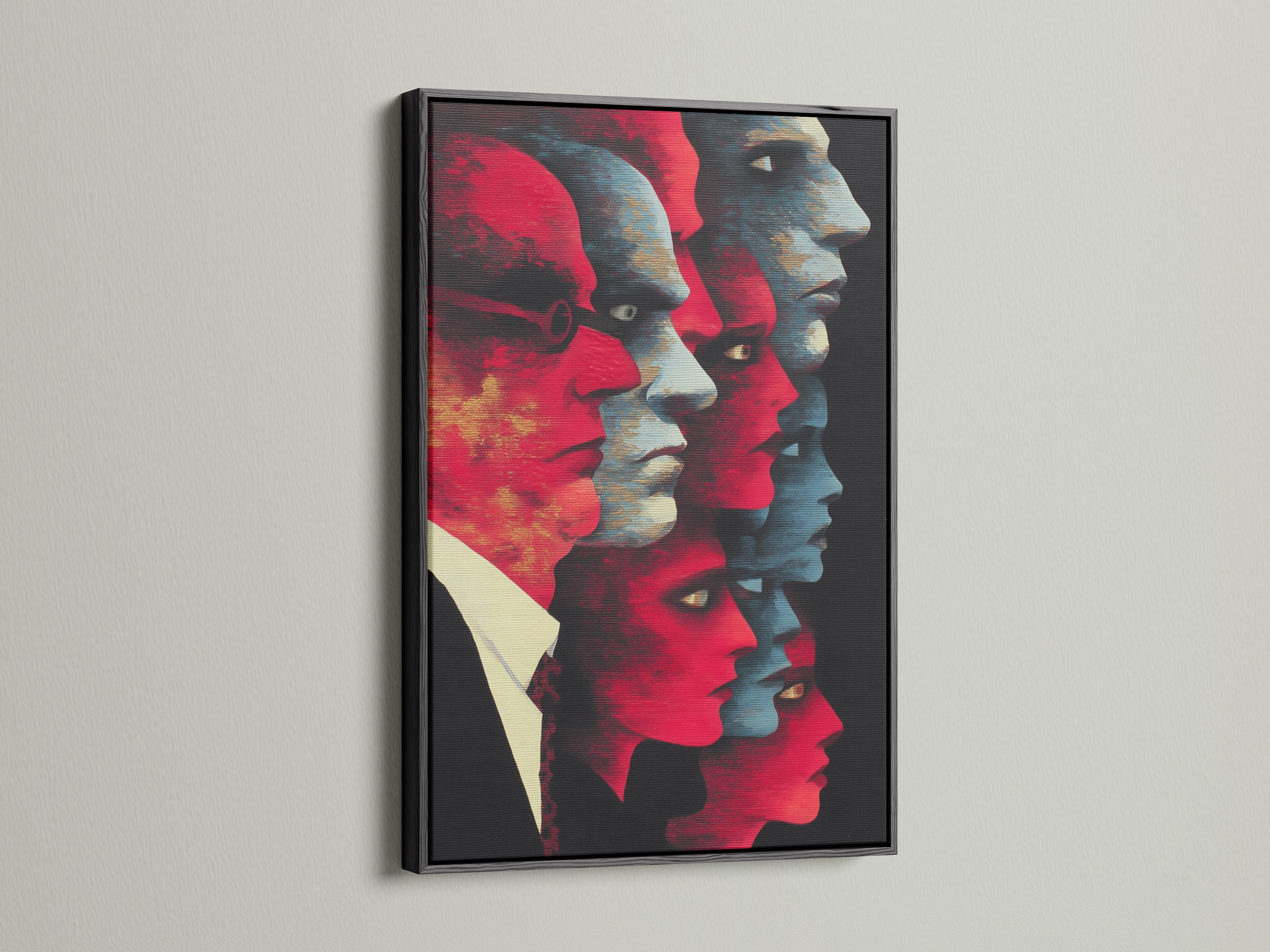 A bold abstract faces canvas print presented in a classic black frame. The red and blue modern portrait artwork adds a sophisticated touch. Ideal for offices or home spaces seeking unique artwork. This contemporary print is perfect for creating a focal point. It elevates minimalist urban and eclectic styles.
