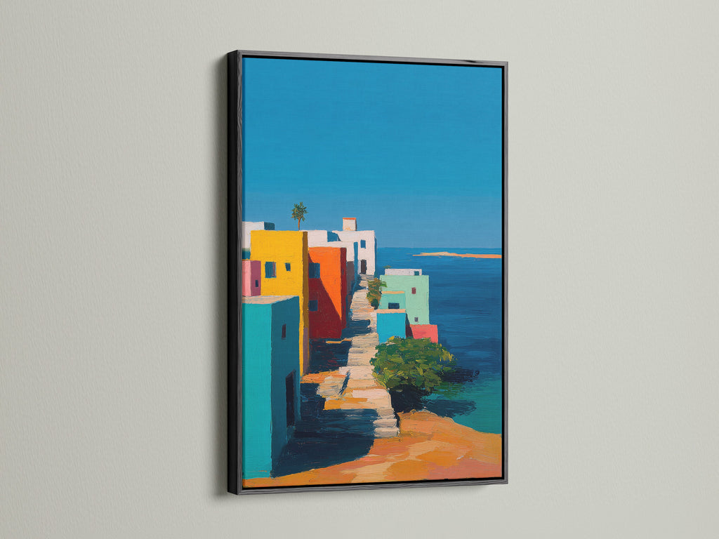 A sleek black frame highlights a captivating art print. The dark frame adds a touch of elegance. The artwork presents a colorful coastal town. It creates a striking contrast against the wall. This art piece draws the viewer in.