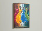 The Dancing Figures artwork is showcased in an oak frame. The frame enhances the colorful abstract art. This vibrant movement wall decor is perfect for adding a touch of modern elegance to any room.