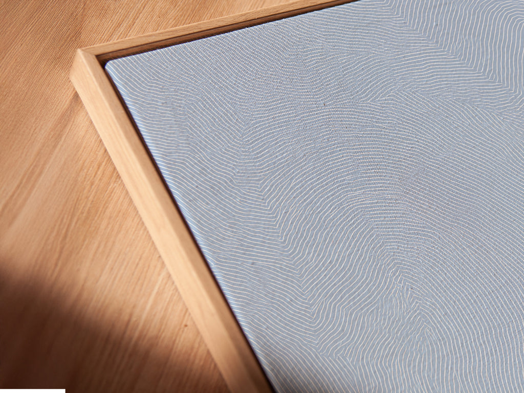 Close-up of a canvas print in a floating frame. The frame enhances depth. The art features fine details and vibrant colors. This modern framing style makes art pop. Perfect for contemporary spaces and art lovers.