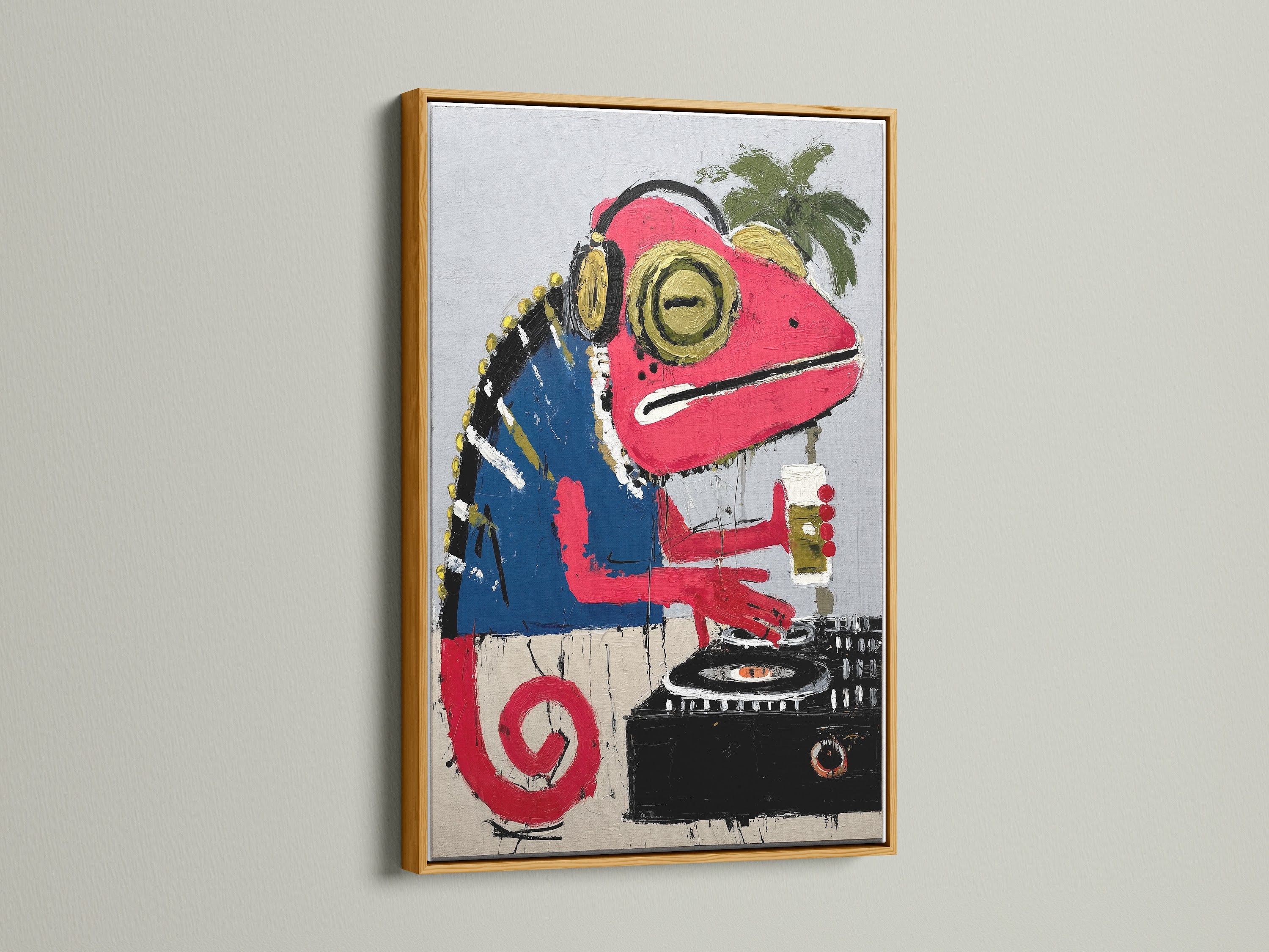 Iguana DJ art in a gold frame. Add a touch of luxury with this music wall decor. The artwork features a colorful reptile. Perfect for studio wall art and tropical decor.