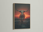 Longhorn bull art printed in an oak frame. The artwork captures a western sunset. It's ideal for adding a rustic touch to your home. This bull canvas print enhances any ranch style decor. A great piece of cowboy wall decor.
