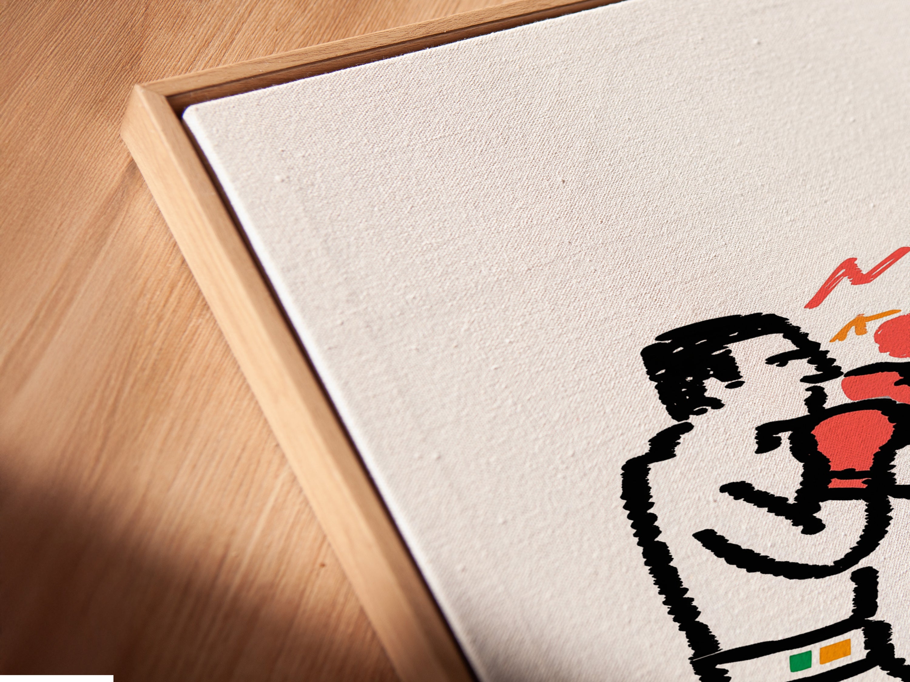 A close-up of the boxing match canvas print in a floating frame. This minimalist sport artwork shows two boxers with red gloves. The floating frame enhances the artwork. Ideal for modern interiors or a home gym. Great gift for boxing fans.