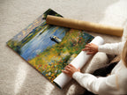 A woman carefully rolls a fine art poster paper. The high-quality paper ensures vibrant colors and longevity. The artist prepares to ship a masterpiece. Experience the beauty of fine art prints. Order your own museum-quality print today.