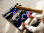 A woman rolls fine art poster paper. This premium paper is perfect for art prints. High-quality material ensures vibrant colors. Preserve artwork with professional-grade paper. Ideal for creating stunning art pieces. Find the ideal paper to complement your artwork. Display your art today.