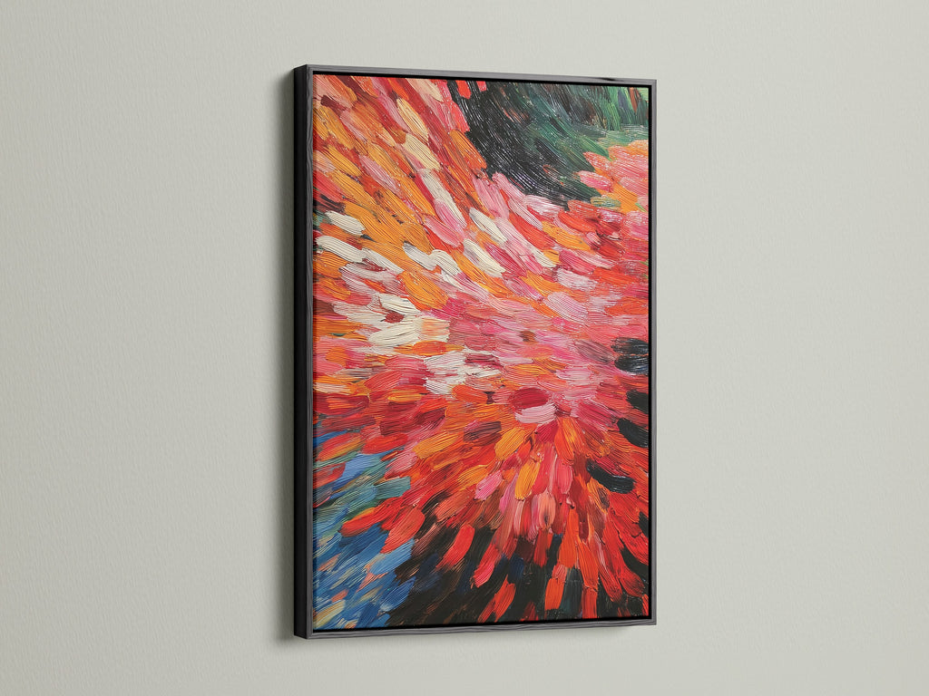 An abstract burst artwork is elegantly framed in black. The vibrant red and orange hues bring energy to the artwork. Its dynamic brushstrokes enhance modern spaces. It will complement minimalist Scandinavian or eclectic styles. Add this bold canvas art to your decor.