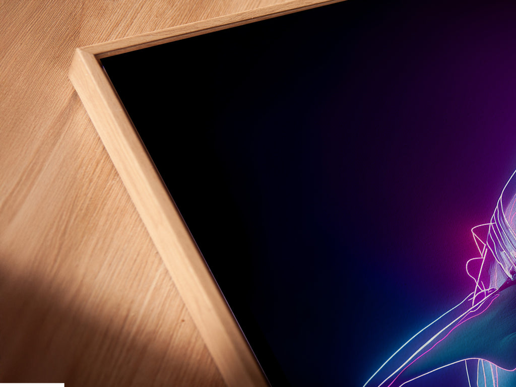 Close-up angled view of a canvas print in a floating frame. The floating frame gives the illusion of artwork suspended in air. This modern framing style adds depth and dimension. The canvas print is beautifully showcased. A unique way to display your favorite artwork.