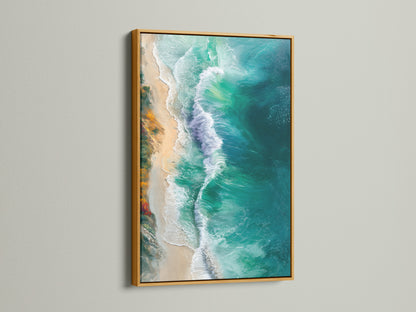 The gold frame highlights the turquoise and teal tones of the aerial beach photography. This ocean waves artwork brings a touch of luxury. It enhances any coastal or tropical themed space.